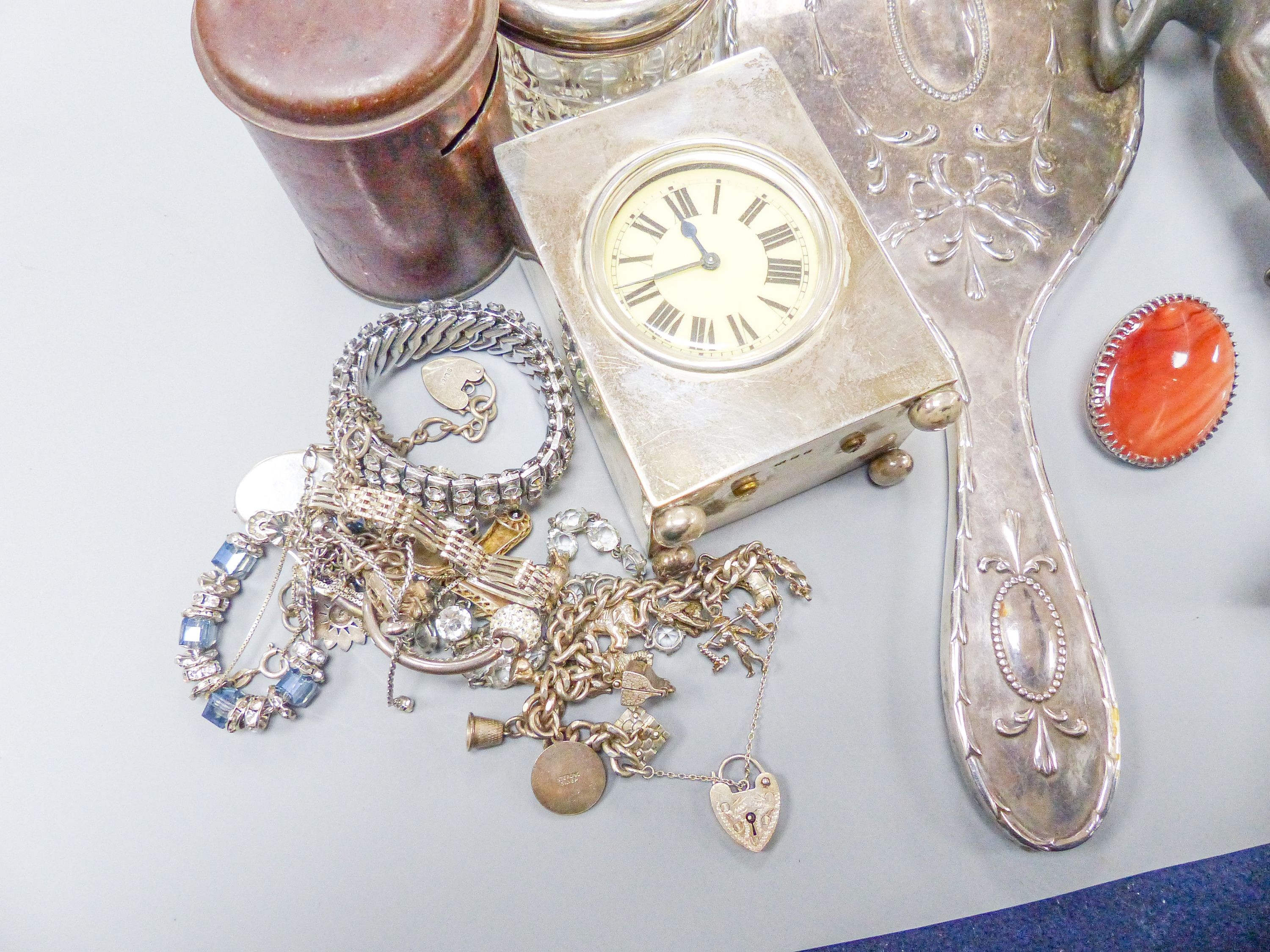 A George V silver cased carriage timepiece, London, 1926, 9cm and other assorted collectables including costume jewellery, amber necklace, etc.